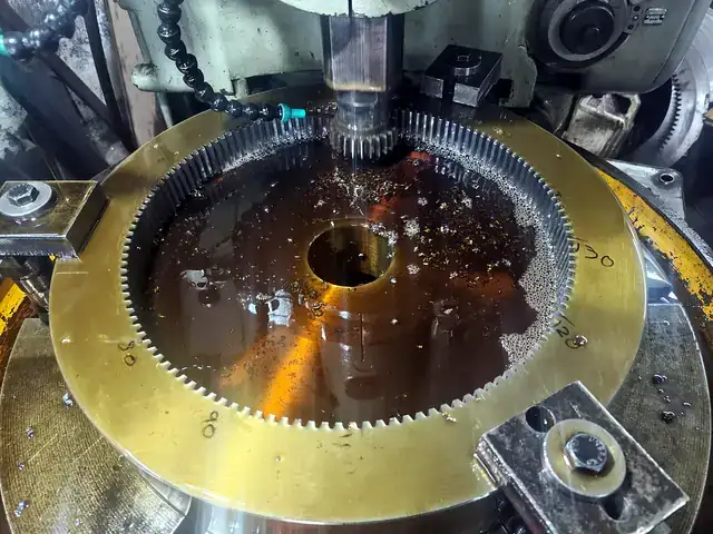 Internal gear being shaped on a gear shaper